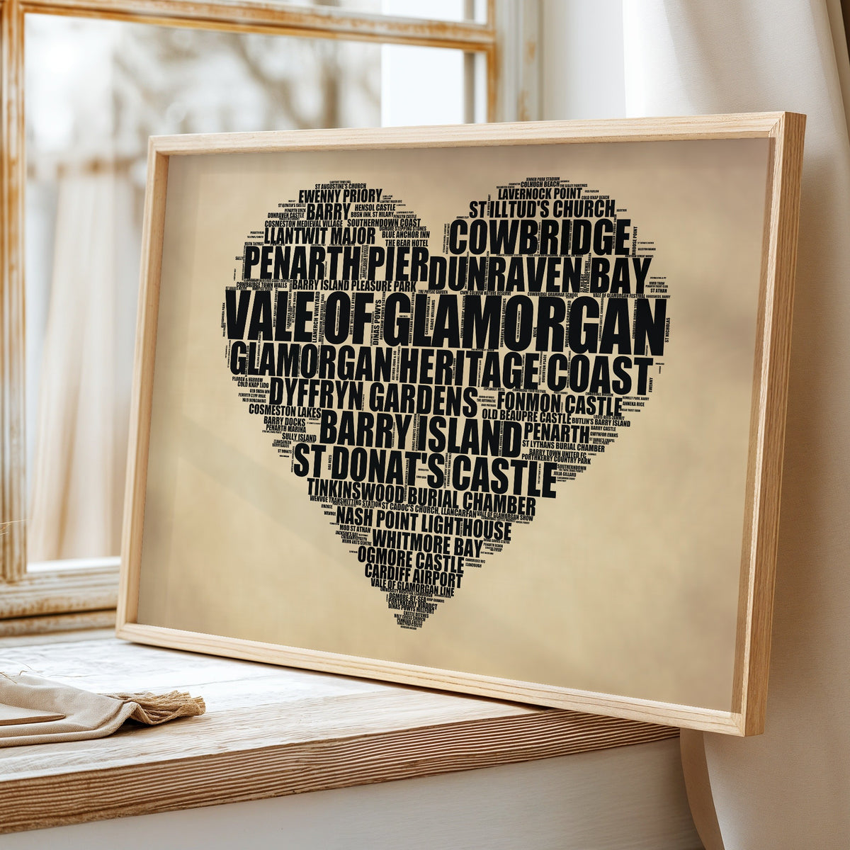 Vale Of Glamorgan heart word art print on a windowsill, rustic heart-shaped poster of Vale Of Glamorgan landmarks